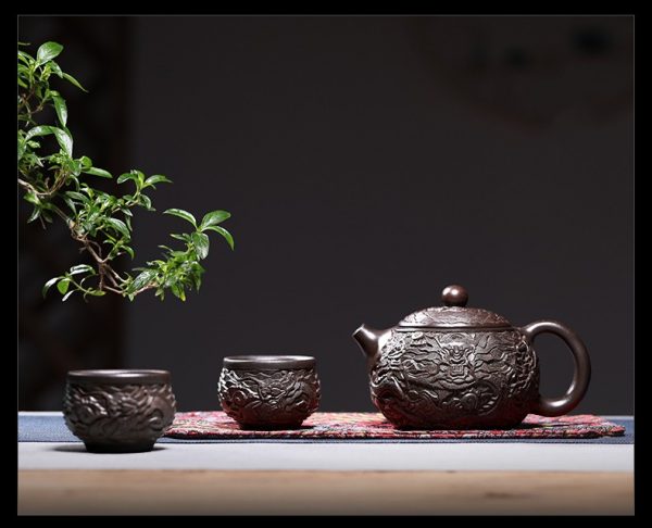 исинский чайник си ши ручной работы с резьбой 19 Коллекционный исинский чайник си ши ручной работы с резьбой, черная глина хей ни, 4 чашки